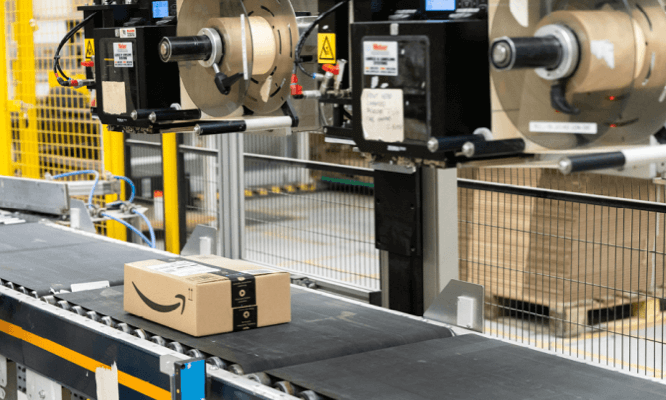 A package moving down conveyor belt in an Amazon factory